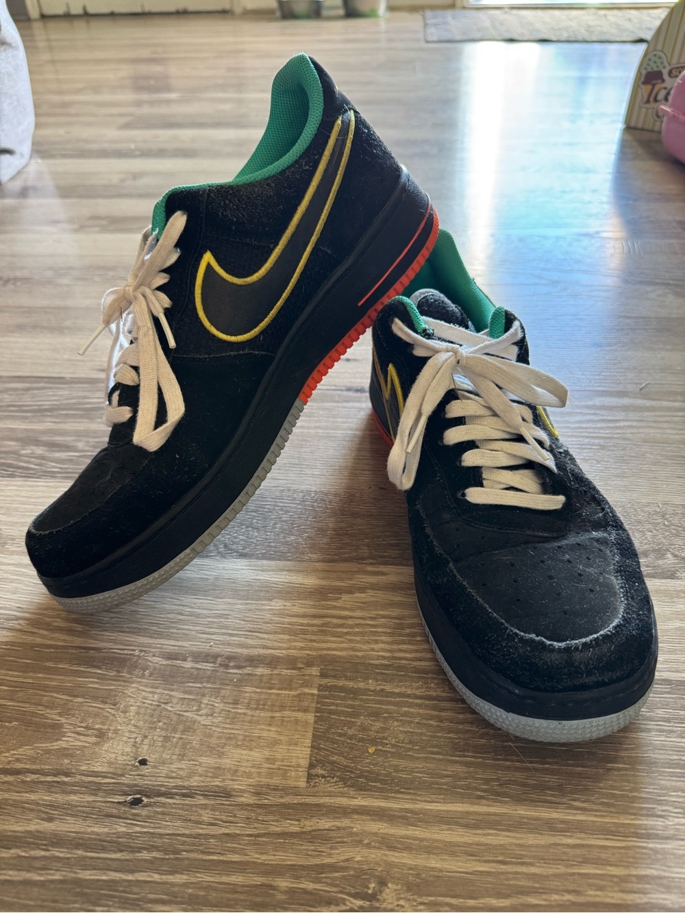 Nike Men’s Black Air Force ones size 12. Black yellow and green